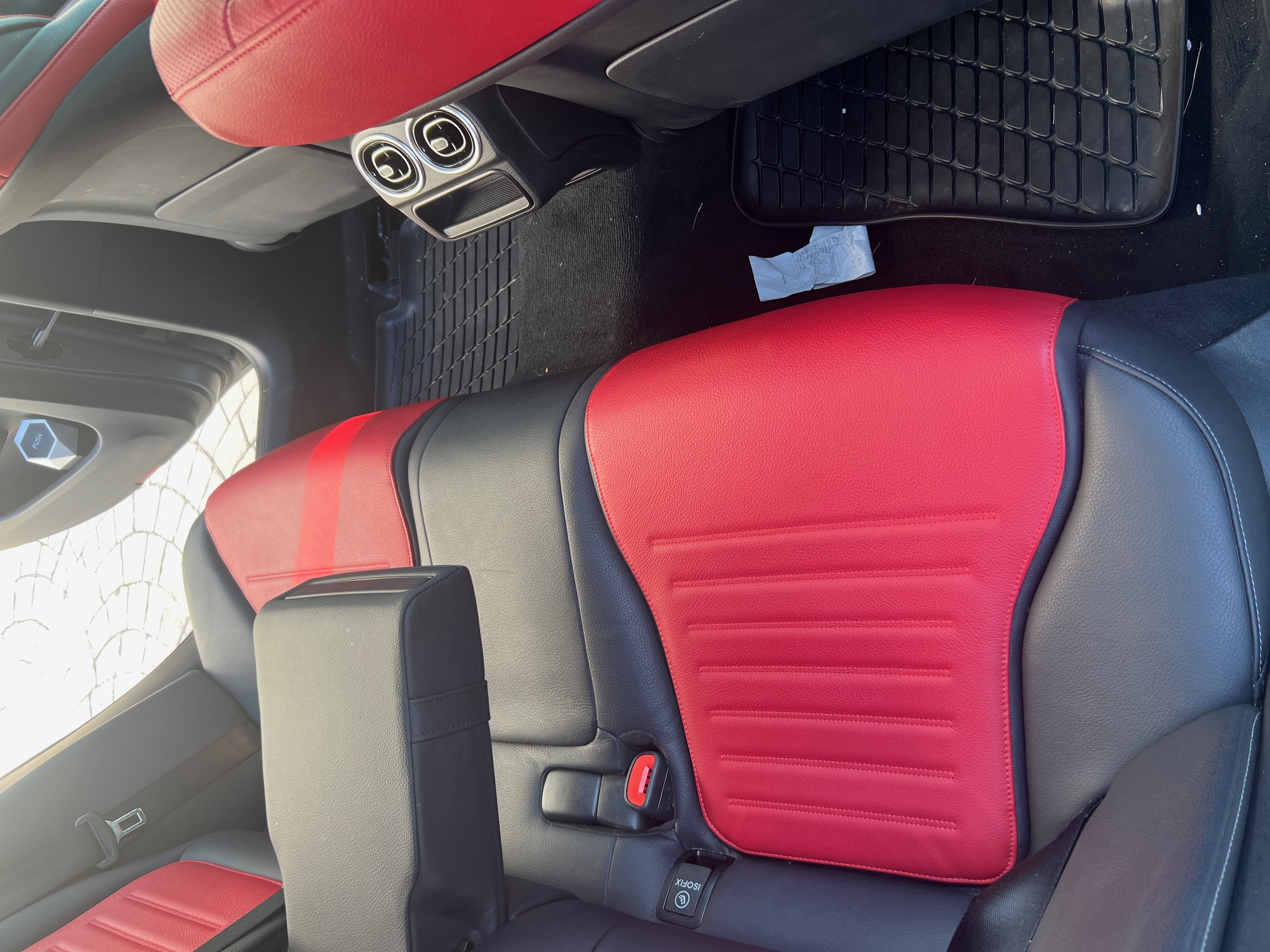 Before interior detail showing rear seat and floor area needing cleanup