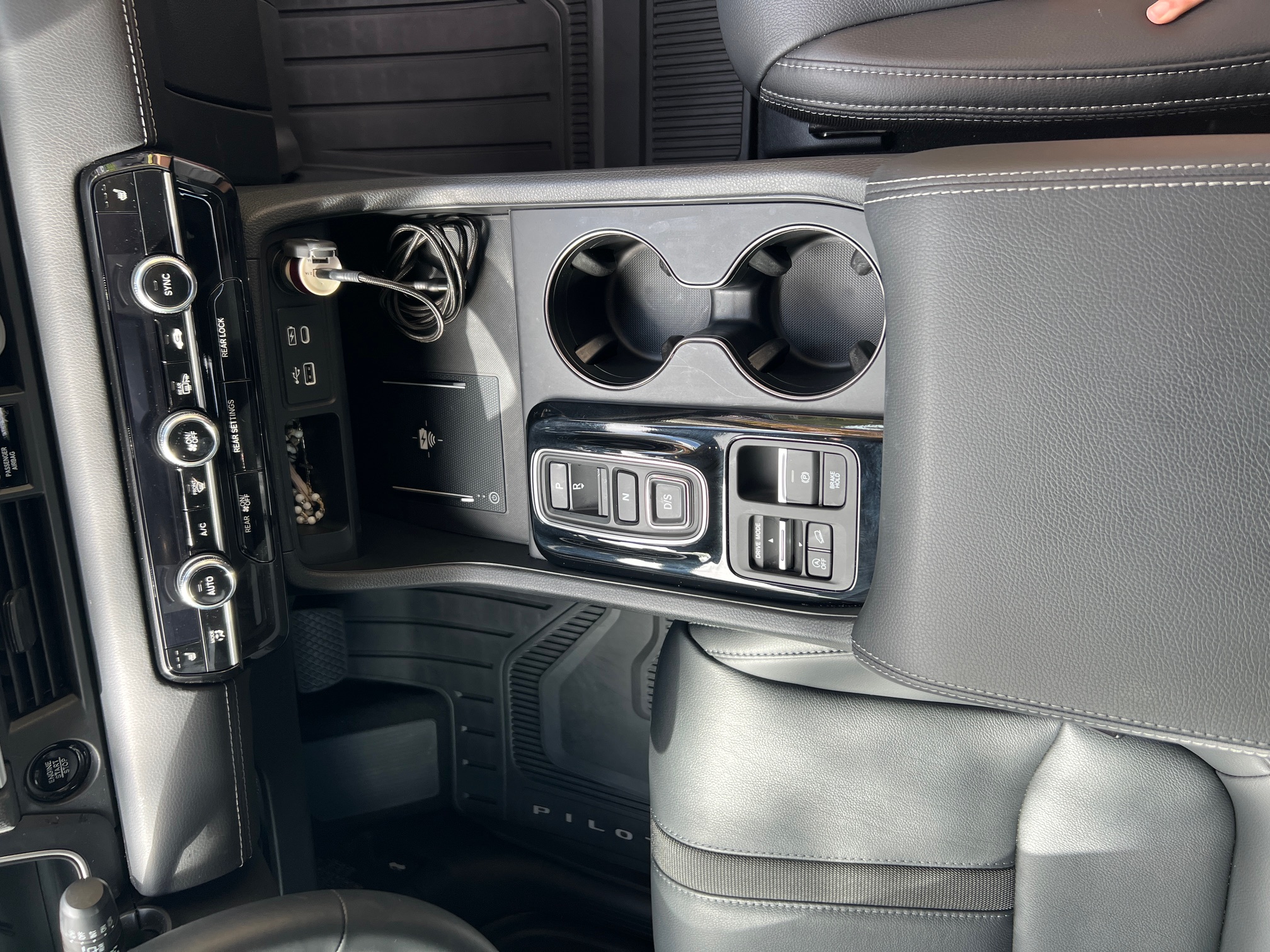 Detailed clean car interior center console after YesterDay Car Detailing service